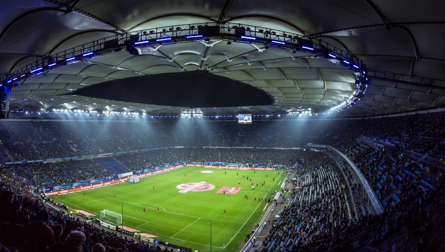 Stadion sepak bola saat pertandingan - ilustrasi artikel sportsbook Ugbet88